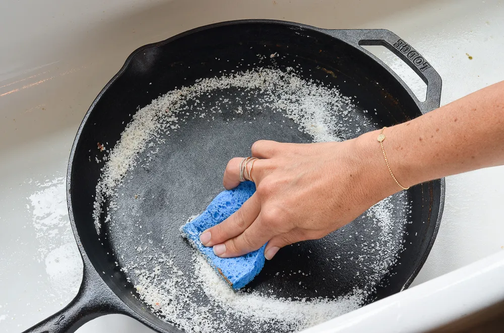 Use Salt to Clean Stubborn Stains cast iron pan.webp